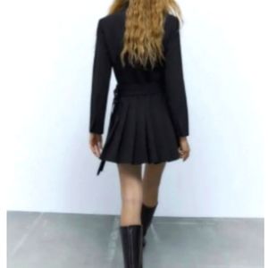 Very stylish blazer jacket with pleats. Brand new, never worn with tags.